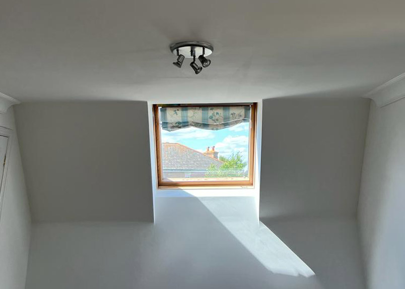 Painted hallway and staircase in Aylesbury with neat woodwork and bannisters